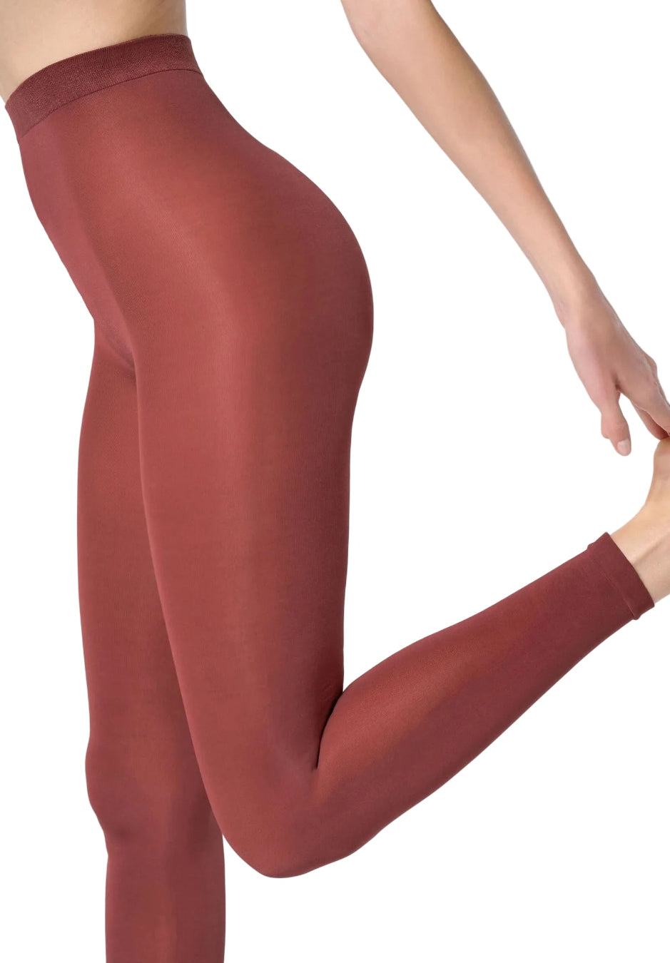 Maroon leggings worn by a person on a white background