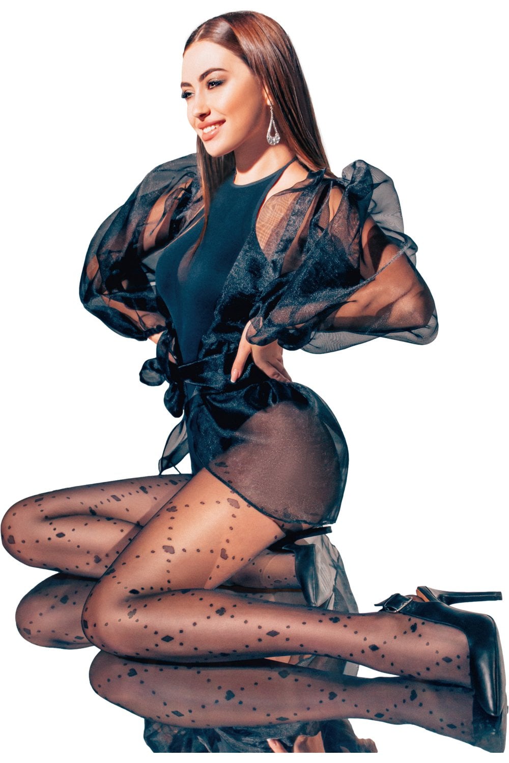 Model wearing black giulia patterned tights with a black outfit and heels