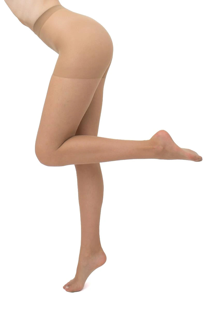 A model's lower body wearing sheer beige hosiery, shown from the waist down in a side profile with one leg bent and the other extended, against a plain white background.
