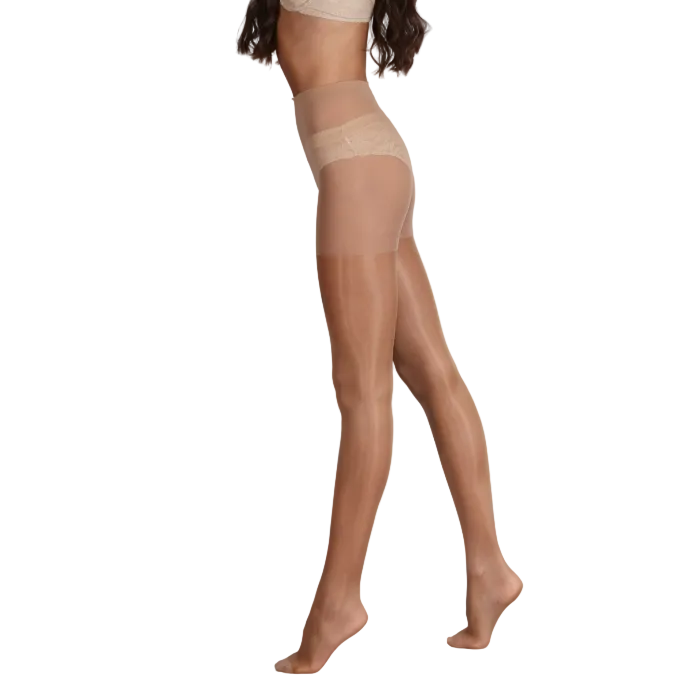 Beige sheer tights worn by a person on a white background