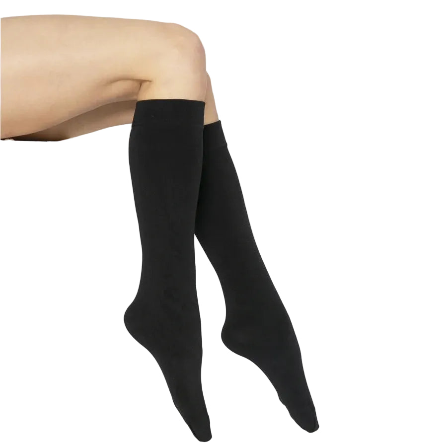 Model wearing thermal fleece lined 200 denier knee highs