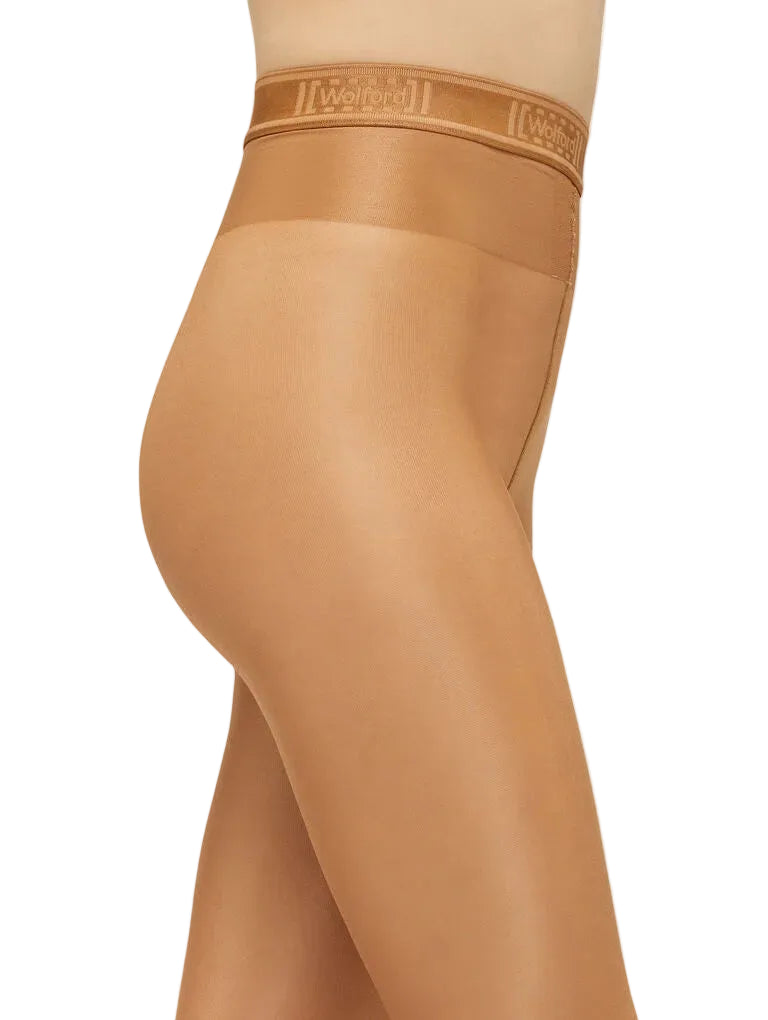 Beige tights with Wolford logo on a white background