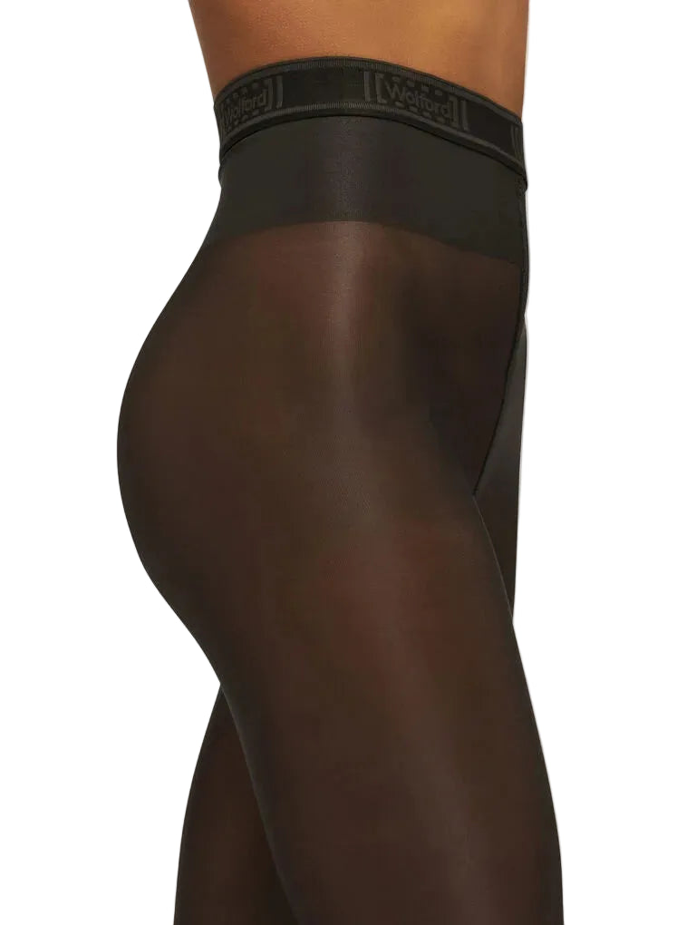 Black tights tights worn by a person on a white background